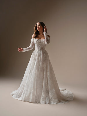 Long-sleeve lace A-line wedding dress with fitted bodice and flowing skirt, featuring a sweetheart neckline.